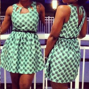 Short cocktail dress with cutouts